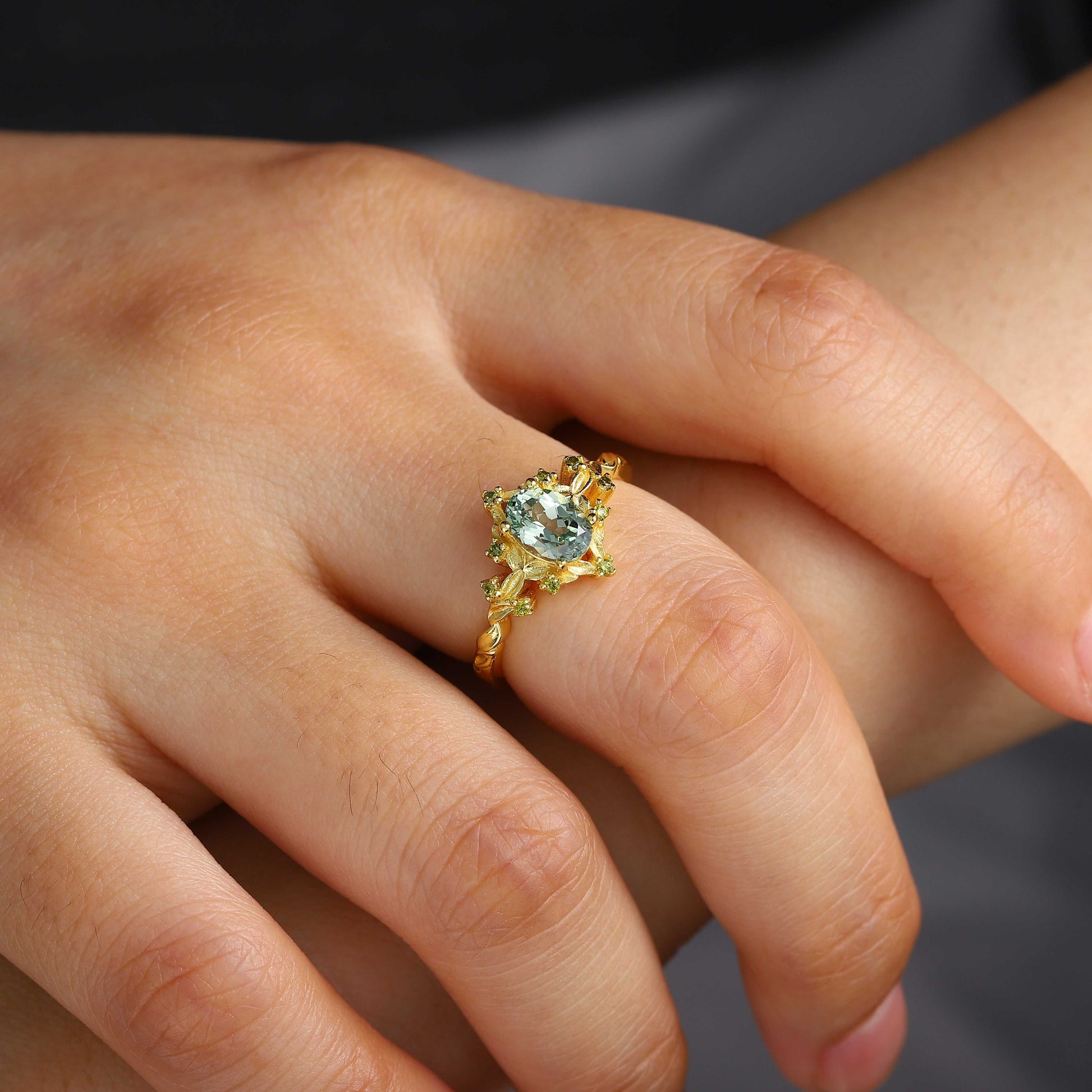 Xevoria solitaire engagement ring with oval sandstone centerpiece and gold band