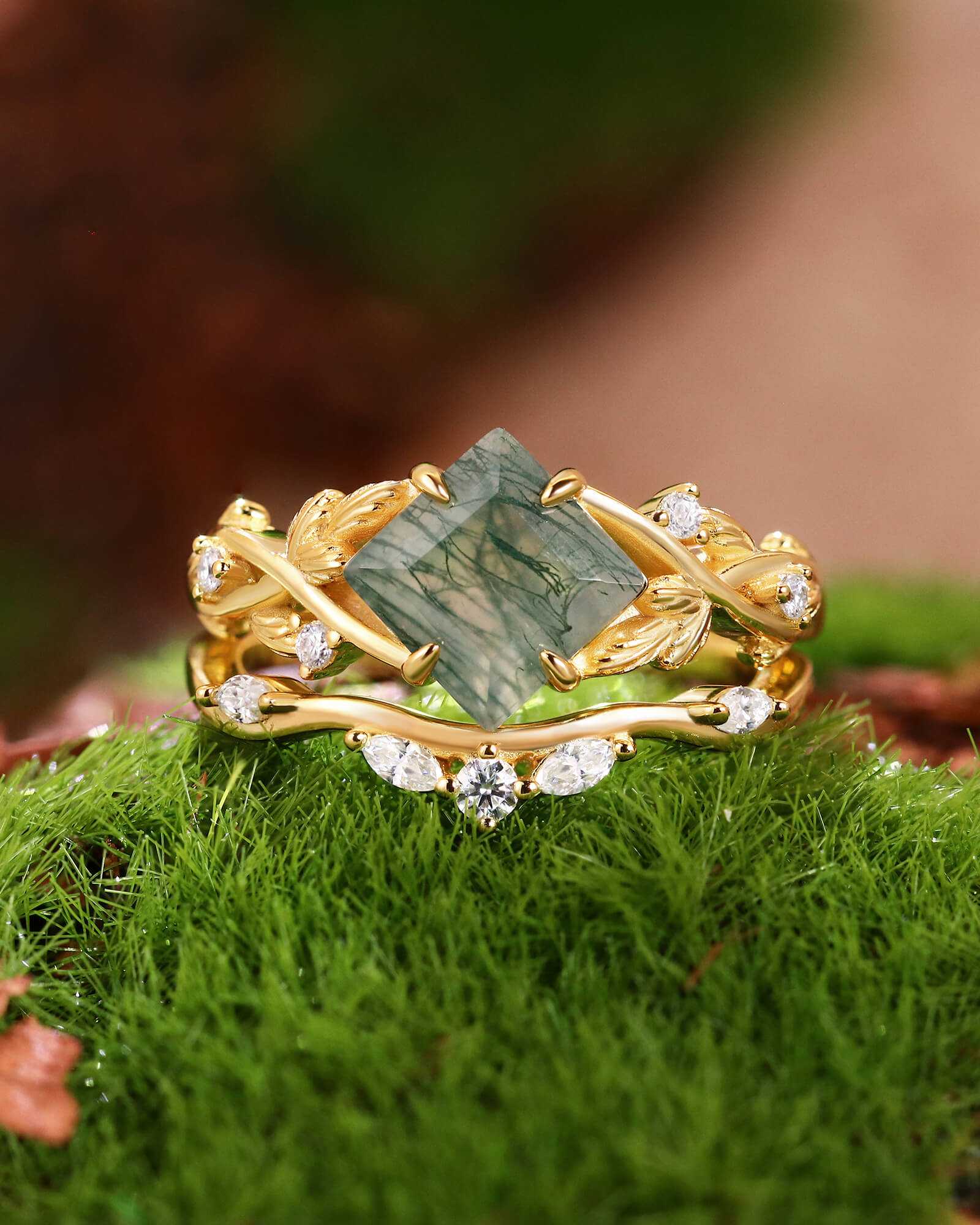 Zilarwen gold stackable ring set with princess-cut moss agate and moissanite stones on green moss background