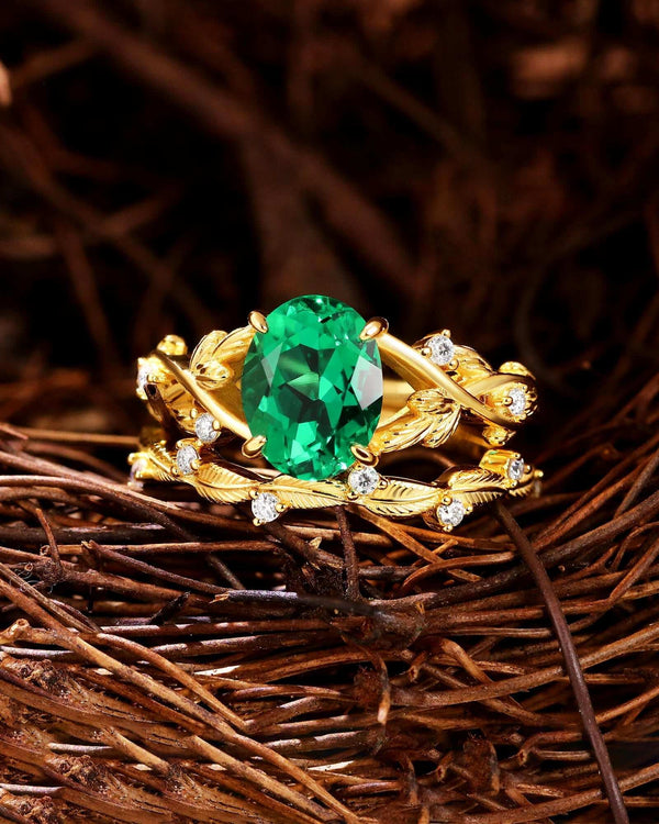 gold stackable ring set with oval lab-grown emerald and moissanite accents on delicate bands
