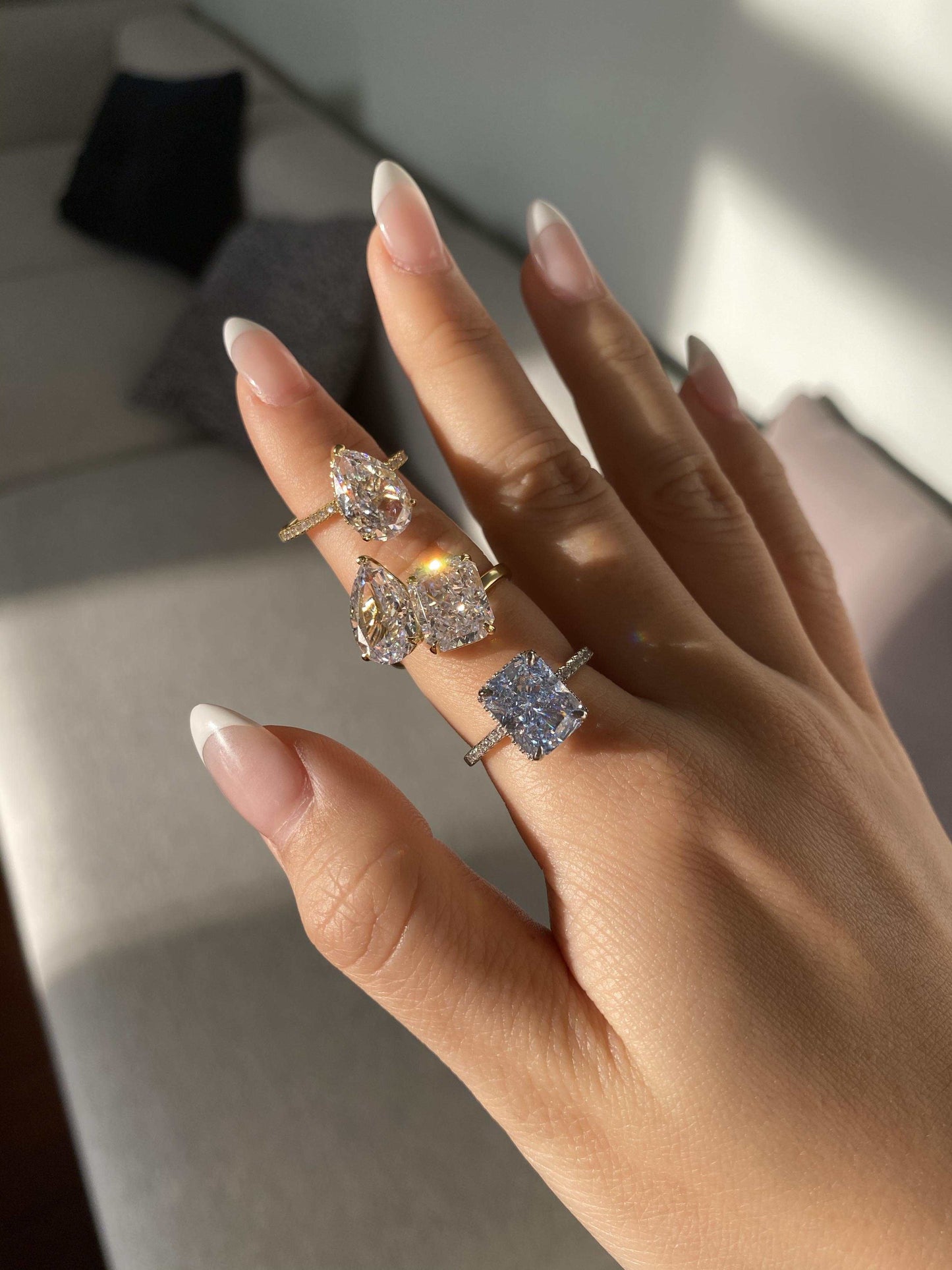 Lalinor engagement ring with 6.5-carat pear-shaped moissanite stones in a Toi Et Moi design on hand