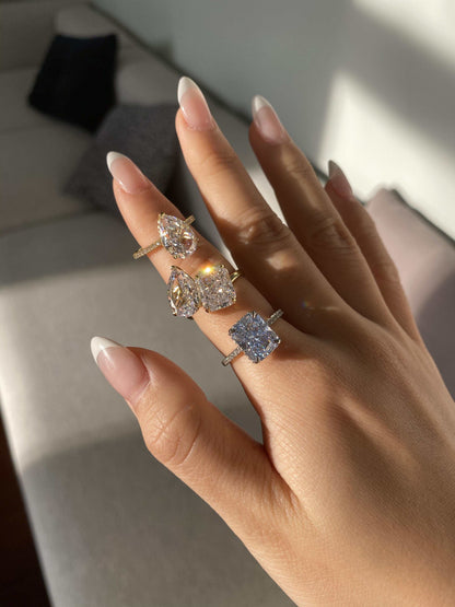 Lalinor engagement ring with 6.5-carat pear-shaped moissanite stones in a Toi Et Moi design on hand