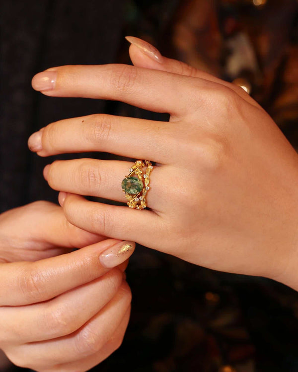 Ciraviel gold ring set with oval Moss Agate center and Moissanite stones on delicate bands