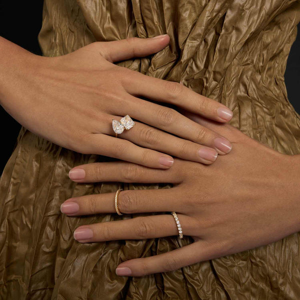 Lalinor Toi Et Moi engagement ring with pear-shaped moissanite stones on hand