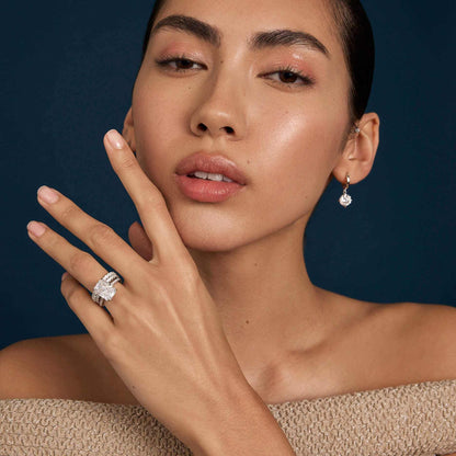 Selene eternity ring with petite round moissanite stones on woman's hand