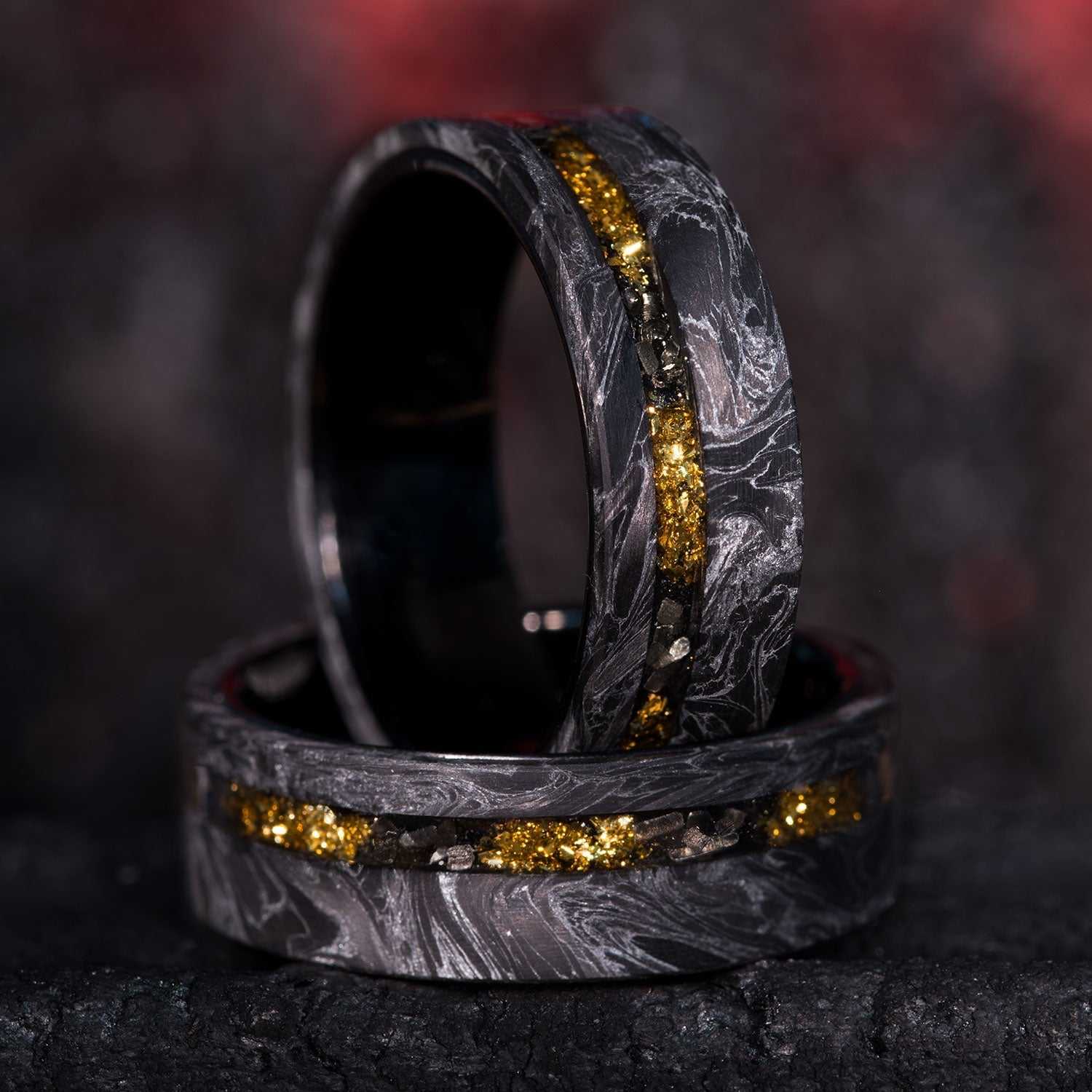 8mm eternity wedding ring with black and silver carbon fiber, 22k gold foil and Gibeon Meteorite inlays, black tungsten sleeves