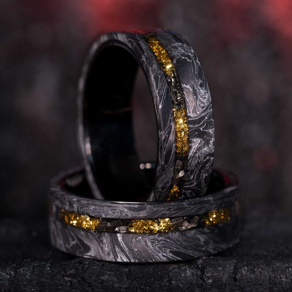 8mm eternity wedding ring with black and silver carbon fiber, 22k gold foil and Gibeon Meteorite inlays, black tungsten sleeves