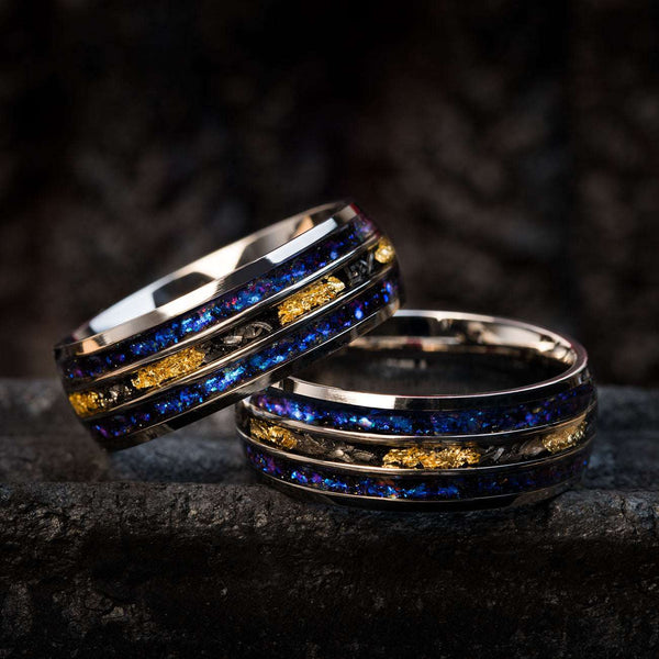 cosmic-inspired wedding rings with star-patterned alexandrite, Gibeon meteorite fragments, and 22k gold leaf detailing