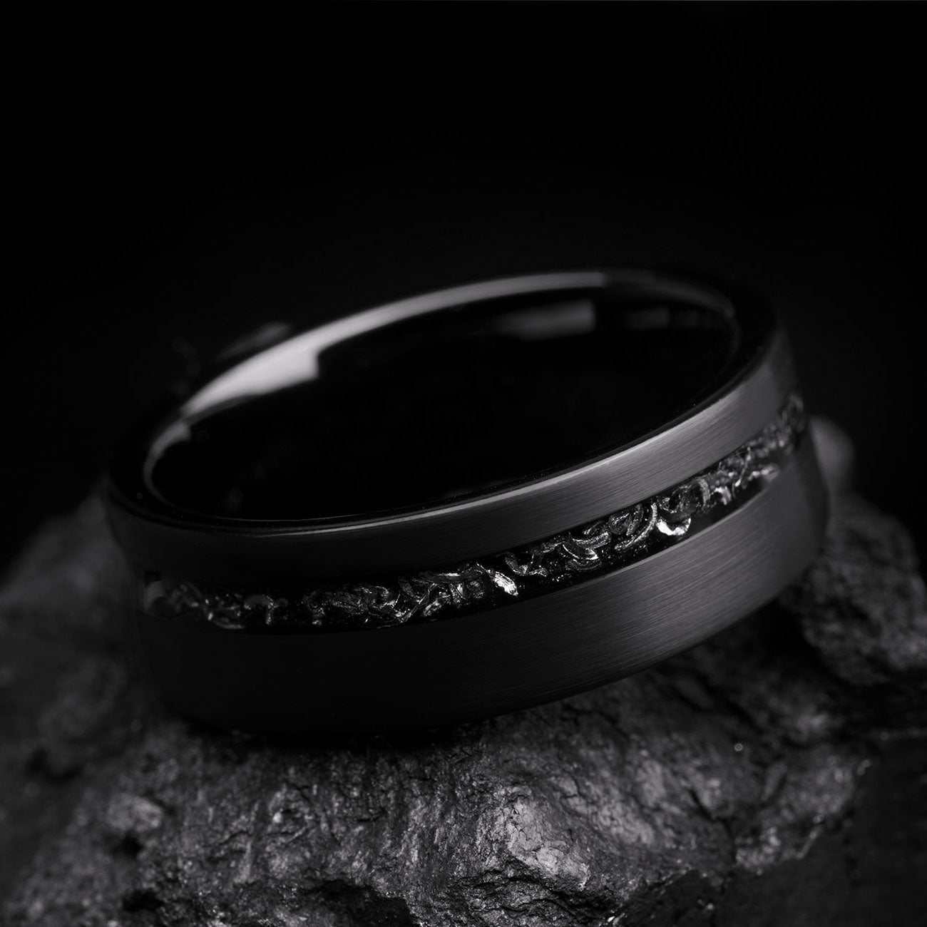 Yiloria black ring with genuine meteorite inlay and eternity design on textured surface