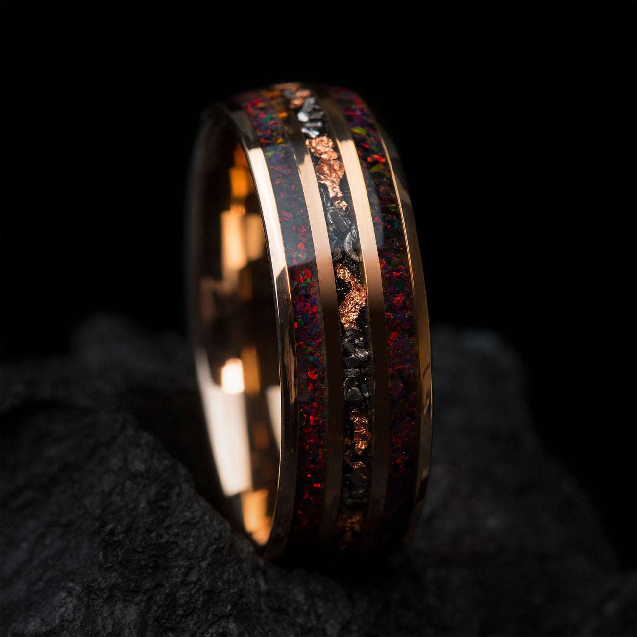 Uloria ring with meteorite and rose gold foil inlay featuring fiery opal gemstone, 8mm wide band symbolizing passion and strength