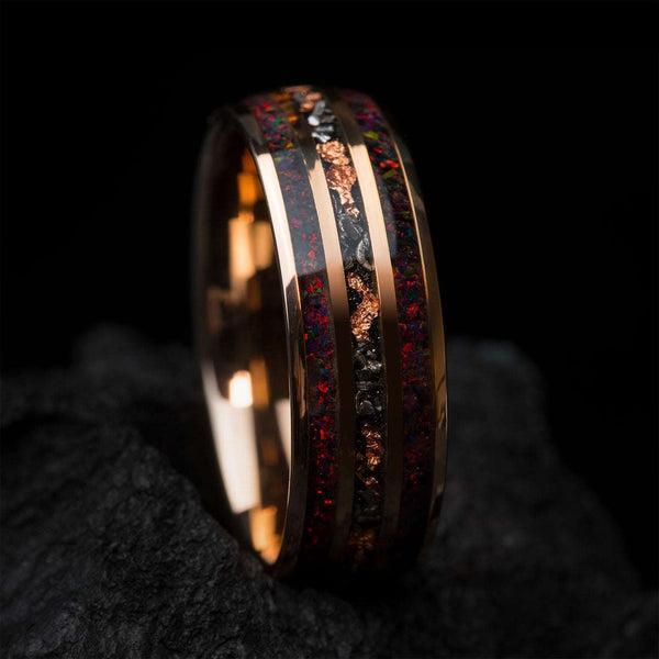 Uloria ring with meteorite and rose gold foil inlay featuring fiery opal gemstone, 8mm wide band symbolizing passion and strength