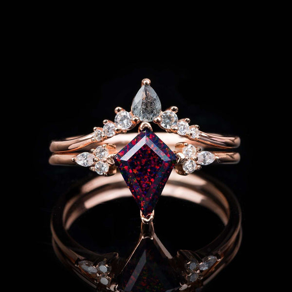 Isolwen stackable ring set with 1.5 ct kite-cut red fire opal, pear-shaped salt and pepper diamonds, and white diamonds in rose gold.