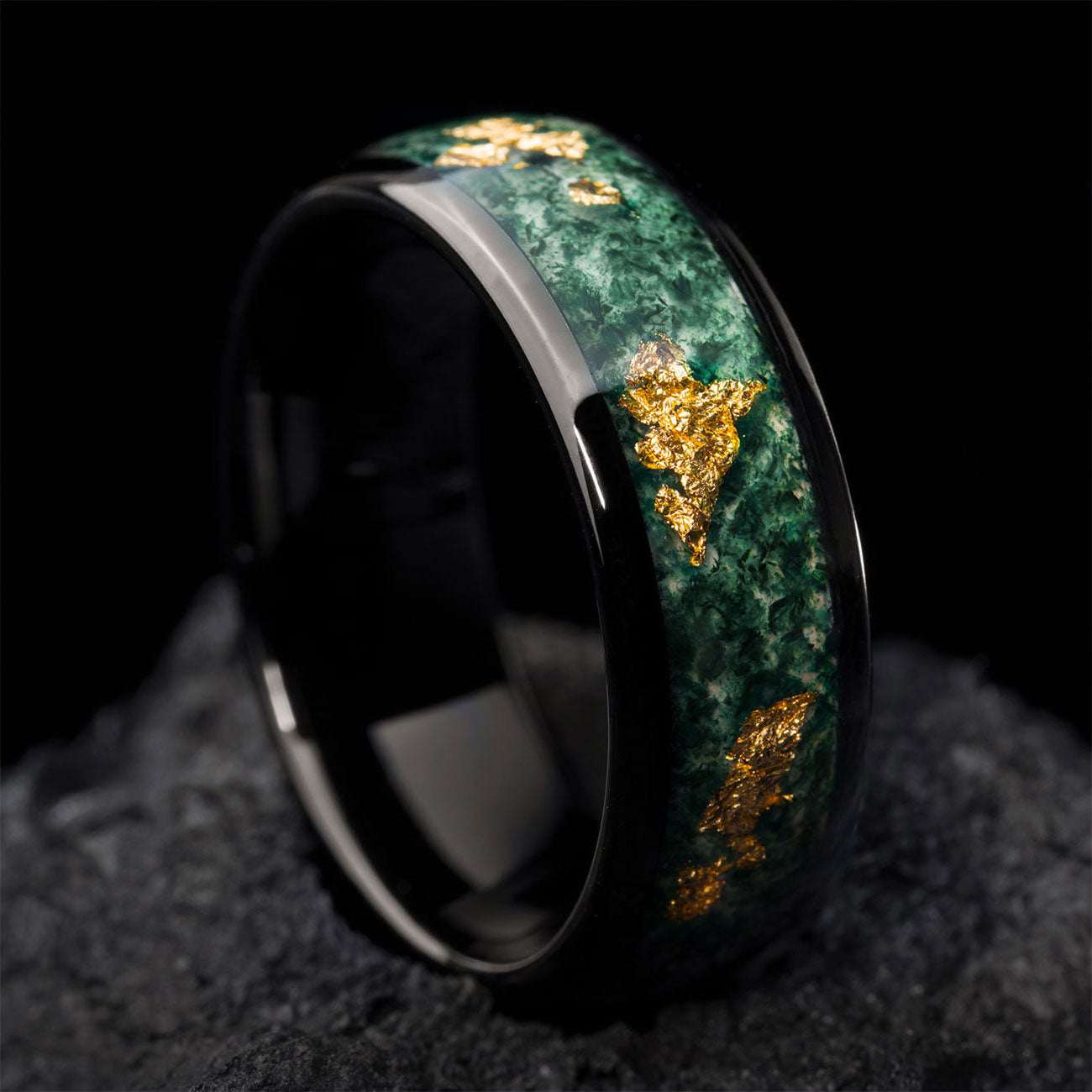Delthriel ring with green moss agate and gold flecks on black band