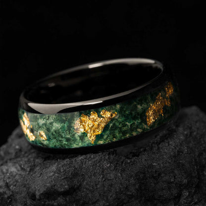 Delthriel green moss agate ring with gold flakes on black background