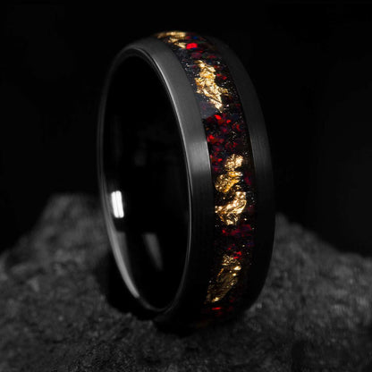 Aureliel wedding band with black tungsten carbide, 22k gold leaf, and opal accents, 8mm wide eternity design.