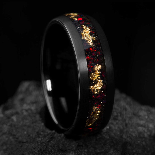 Aureliel wedding band with black tungsten carbide, 22k gold leaf, and opal accents, 8mm wide eternity design.