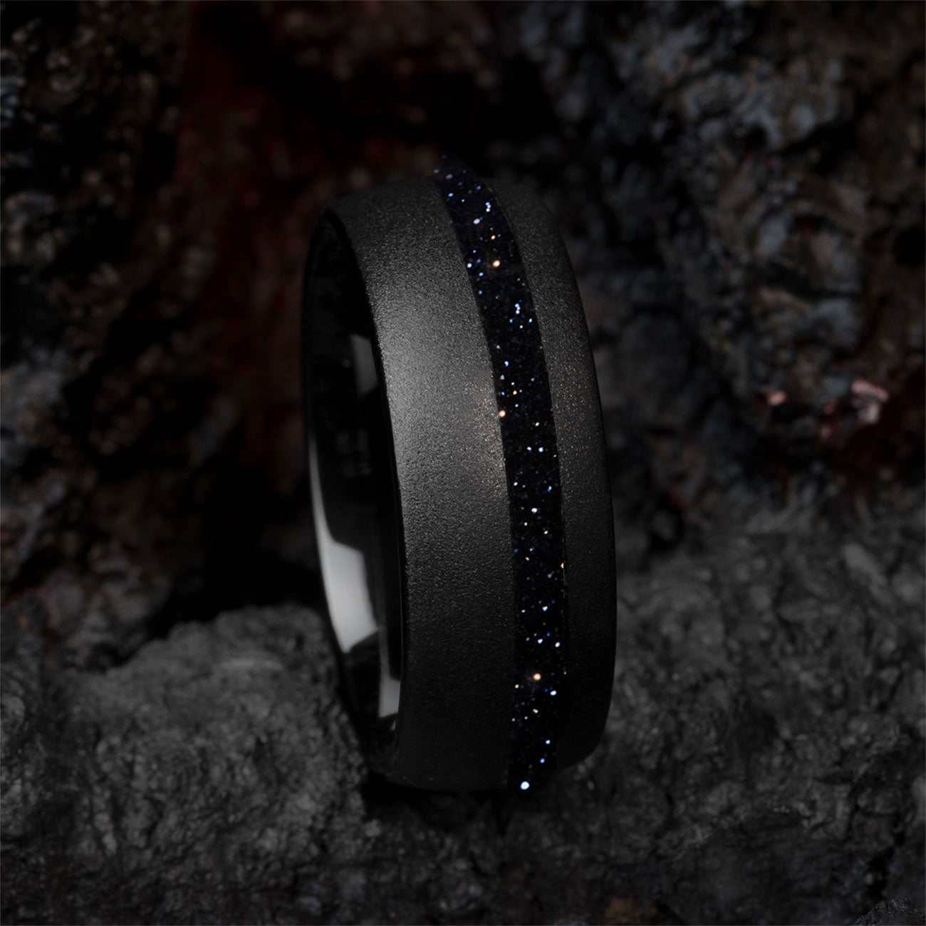 Black tungsten carbide ring with deep blue star Sandstone gemstone and sandblasted finish