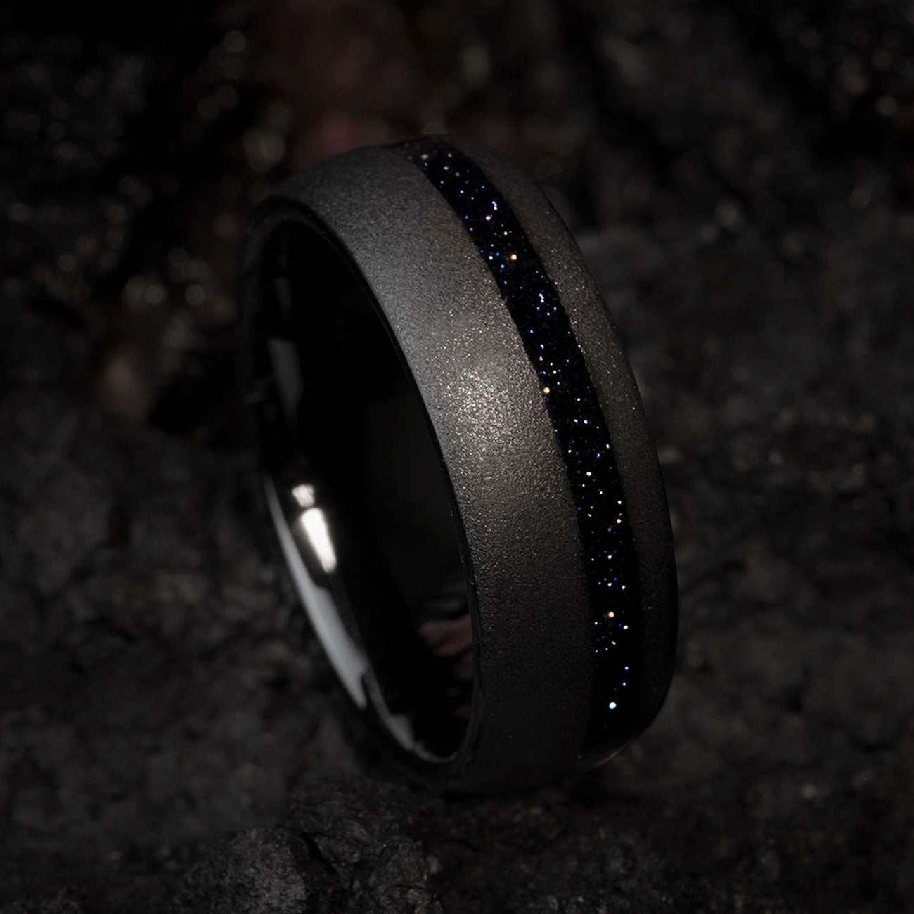 black tungsten carbide ring with deep blue star sandstone and sandblasted finish
