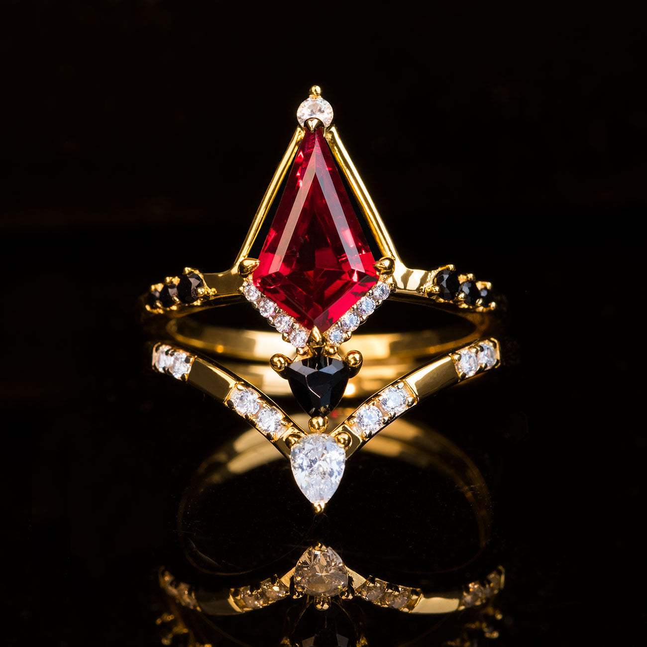 stackable ring set with kite-cut red gemstone and diamond accents on gold bands