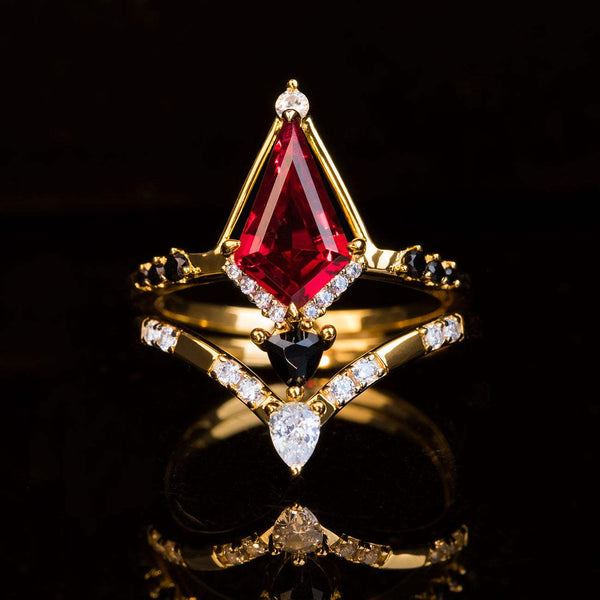 stackable ring set with kite-cut red gemstone and diamond accents on gold bands
