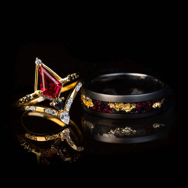 Stackable ring set with men's black tungsten band featuring 22k gold leaf and fiery opal, and women's gold rings with kite-cut red opal and sparkling diamonds.