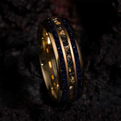 Vessaria eternity ring with gold tungsten, meteorite, 22k gold leaf, and deep blue star sand band.