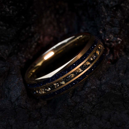 Vessaria eternity ring with gold tungsten, meteorite, 22k gold leaf, and deep blue star sand band.