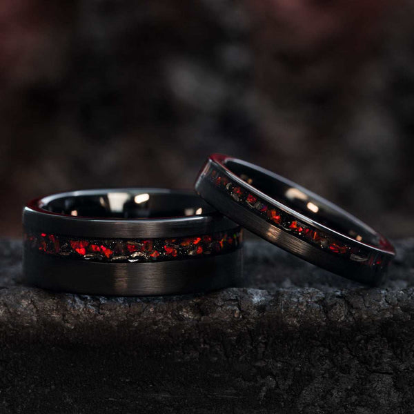 Elariviel 8mm wedding rings with Gibeon meteorite fragments and bright red fire opal accents on dark metal bands