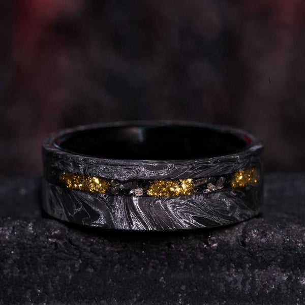 8mm eternity wedding ring with silver swirl carbon fiber, Gibeon meteorite, 22k gold foil inlays, and black tungsten sleeves