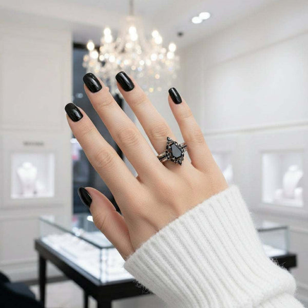 Ivandria stackable ring with black moissanite gemstone on hand in jewelry store