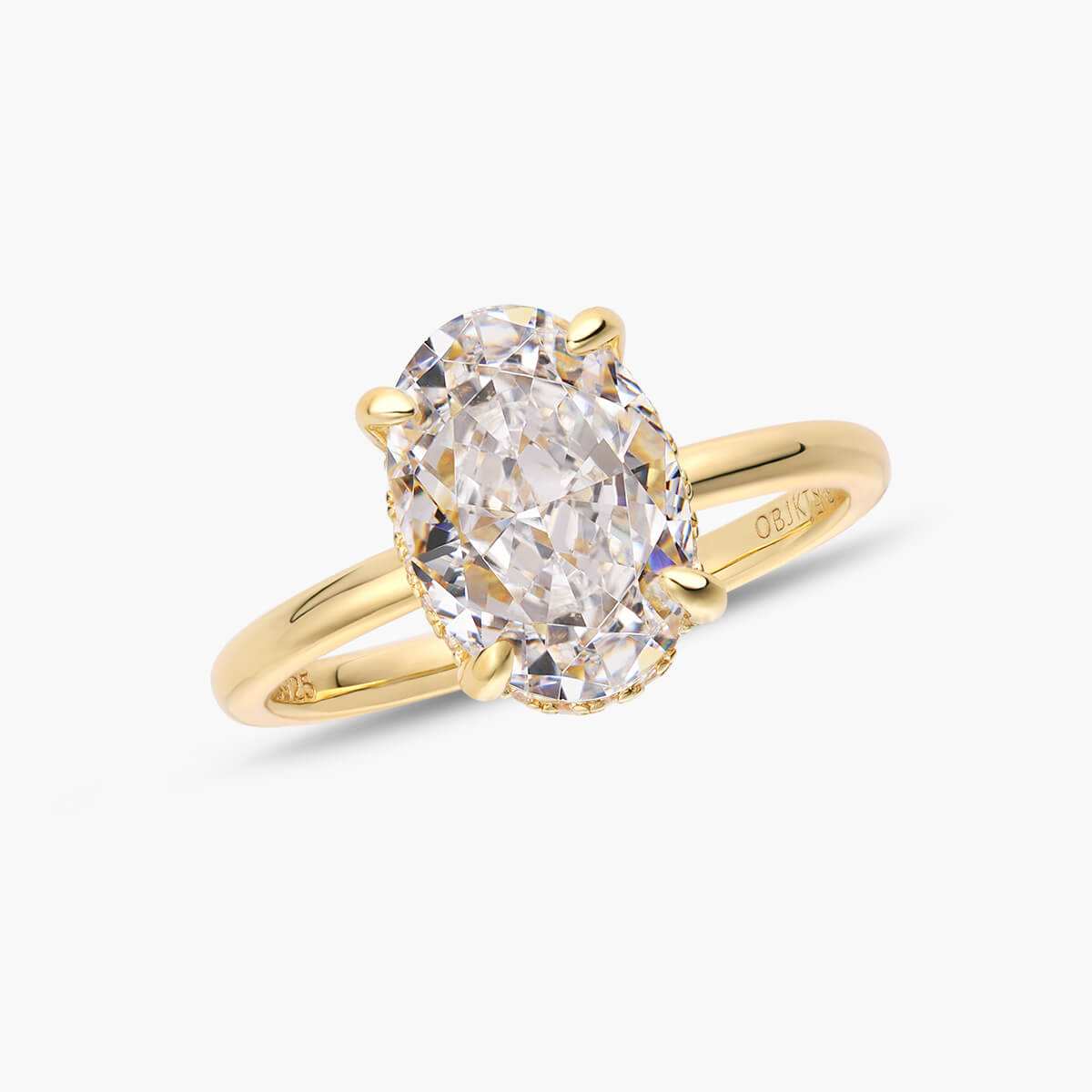 Nolindra solitaire engagement ring with oval Moissanite and pavé hidden halo on gold band
