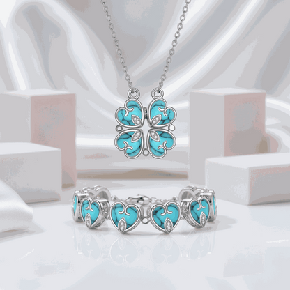 Hesperiel pendant necklace with four interlocking turquoise clover-heart charms and 0.5-carat round moissanite centerpiece.