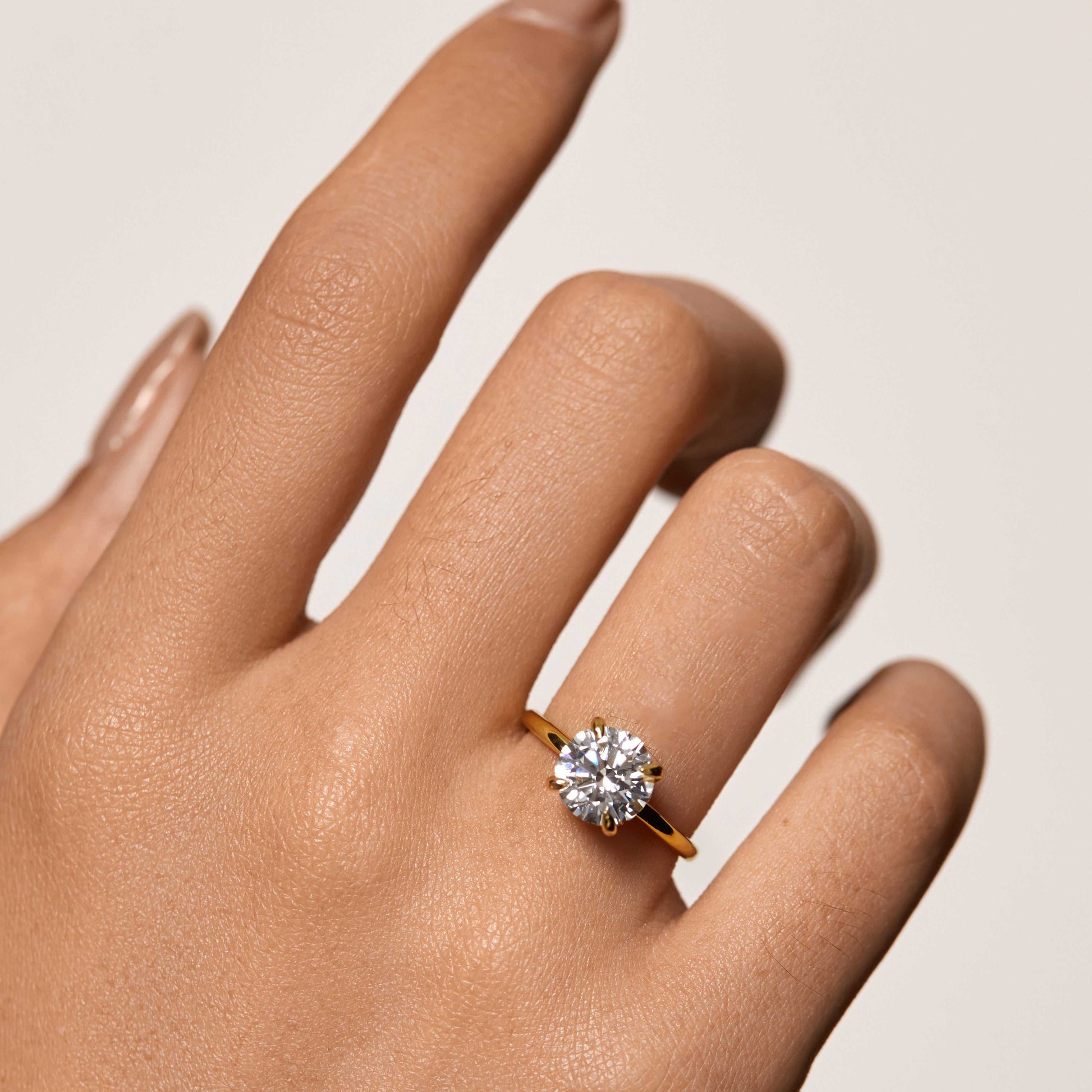 Zaelawen ring with round 2-carat moissanite stone and hidden halo on hand