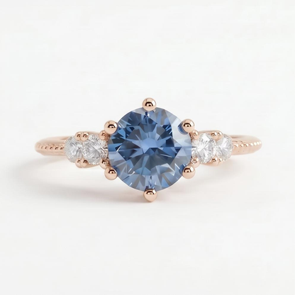 Gloraviel three-stone engagement ring with 1-carat round blue moissanite center and classic design