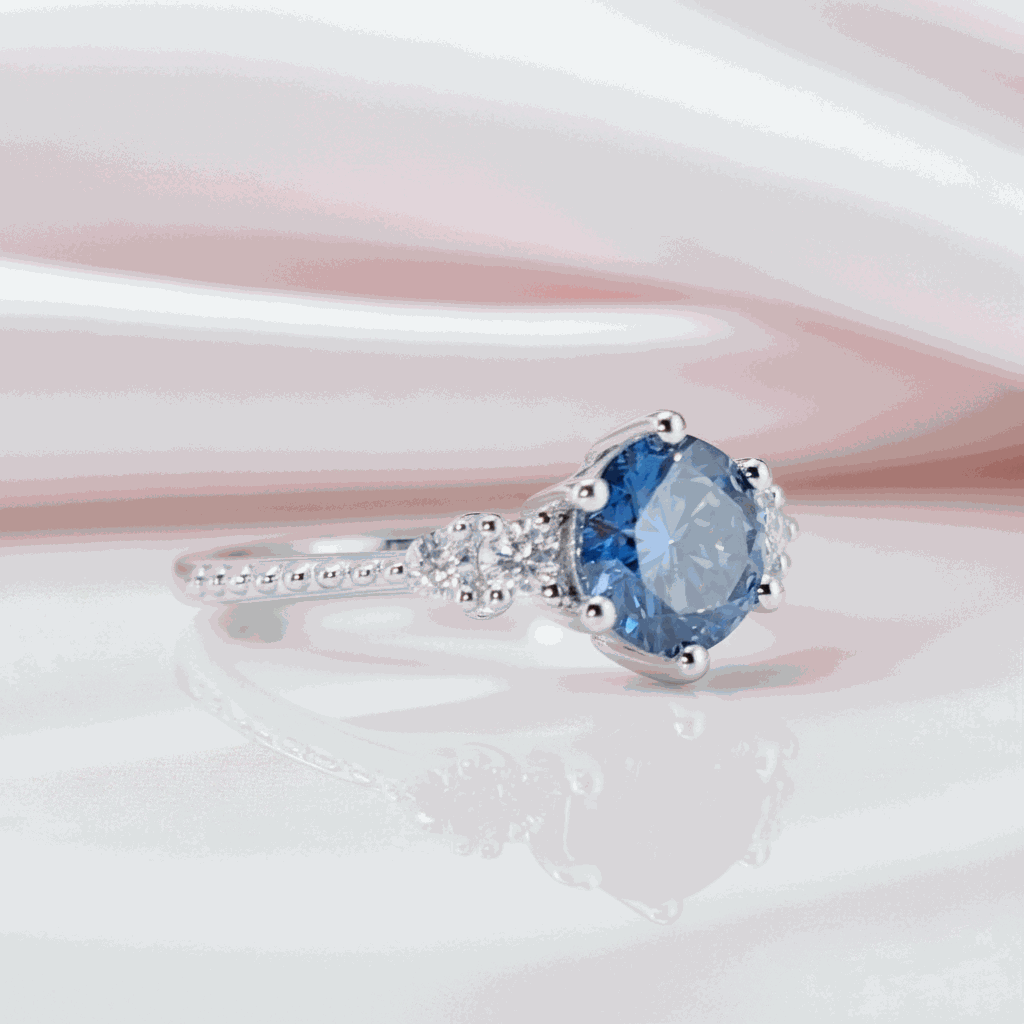Gloraviel three-stone engagement ring with 1-carat round moissanite center and elegant classic design