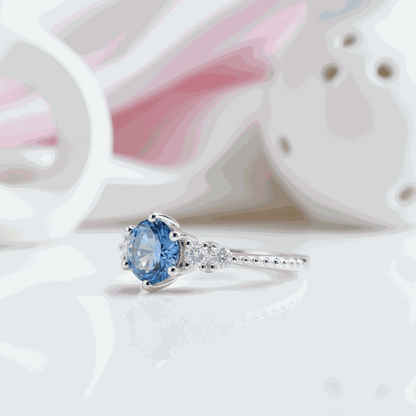 Gloraviel three-stone engagement ring with 1-carat round moissanite centerpiece and classic design
