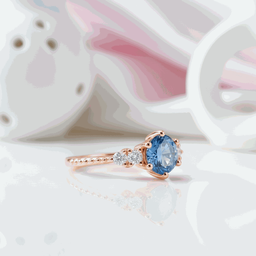 Gloraviel three-stone engagement ring with 1-carat round moissanite centerpiece and rose gold band