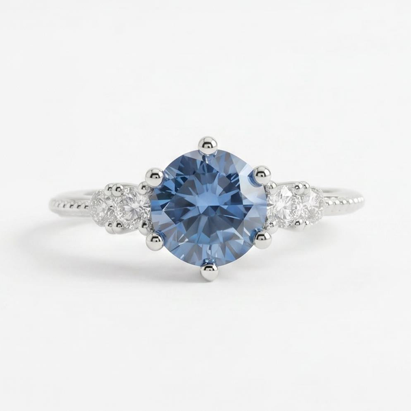 Gloraviel three-stone engagement ring with 1-carat round blue moissanite centerpiece and classic design